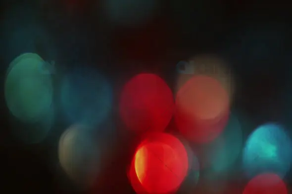 Festive Red and Teal Bokeh Lights on Dark Background for Motion Graphics