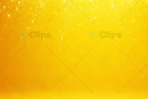Bright Yellow Sparkling Background with Glowing Particles