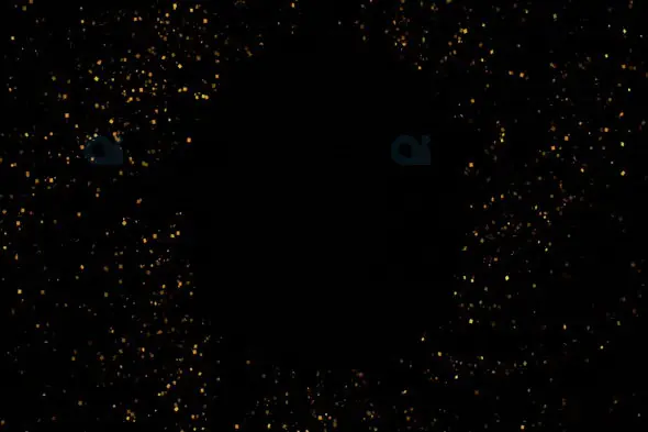 Golden Floating Particles on a Dark Background