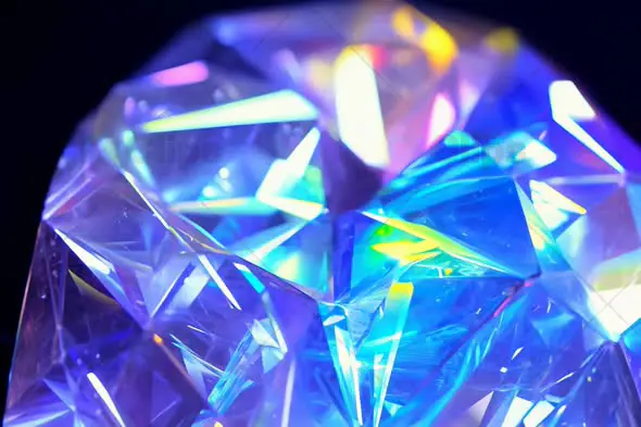 Close-Up of Faceted Gemstone with Colorful Light Reflections