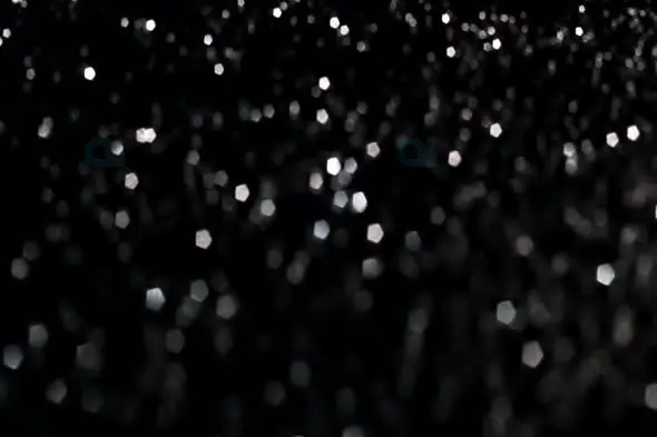 Elegant Silver Bokeh Lights on Black Background