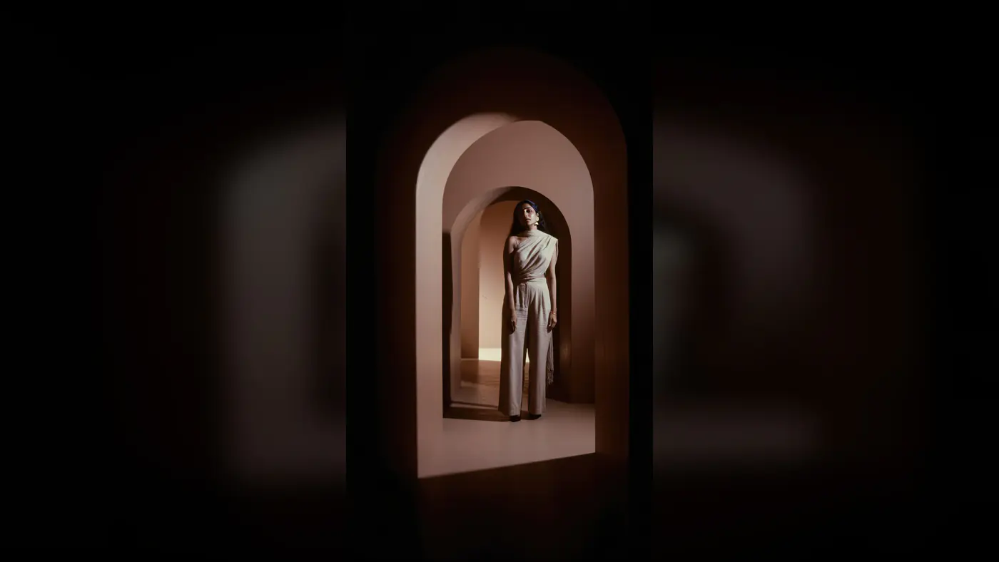 Stylish Indian Woman Framed in Architectural Arches