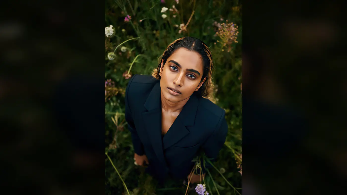 Stylish Indian Woman in Black Blazer Amidst Wildflowers