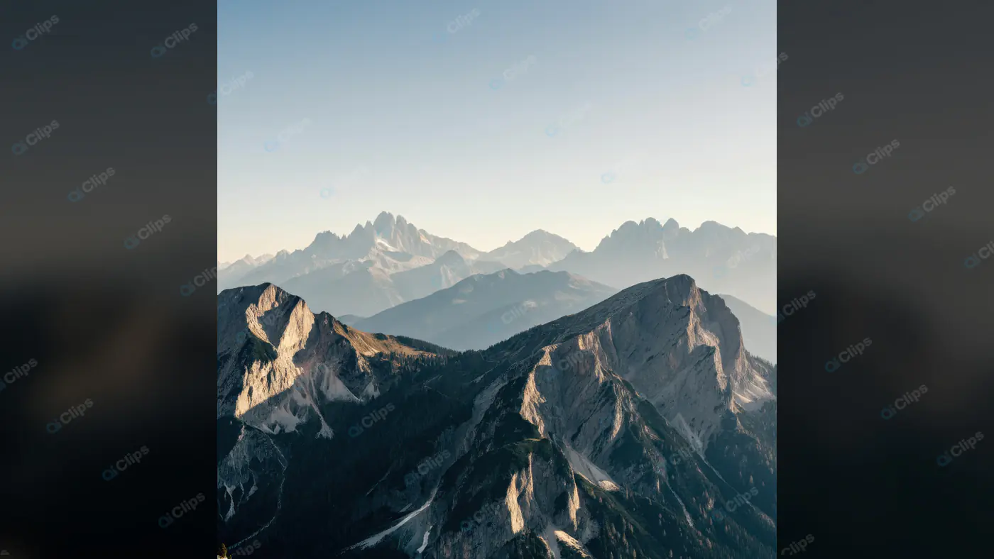 Stunning Mountain Range with Misty Peaks at Sunrise