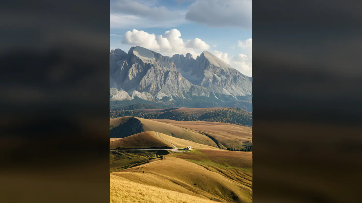 Majestic Mountain Landscape with Rolling Hills and Clouds