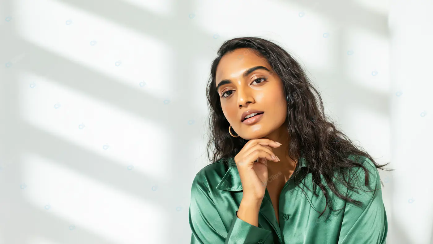 Confident Woman in Green Satin Shirt with Natural Light