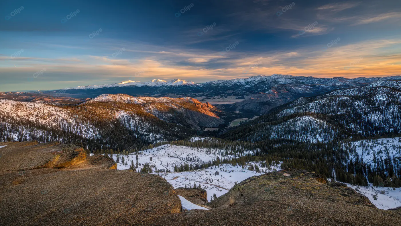 Breathtaking Snowy Mountain Range Panorama at Sunset