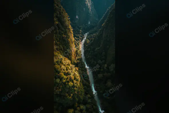 Aerial View of River Flowing Through Lush Green Canyon