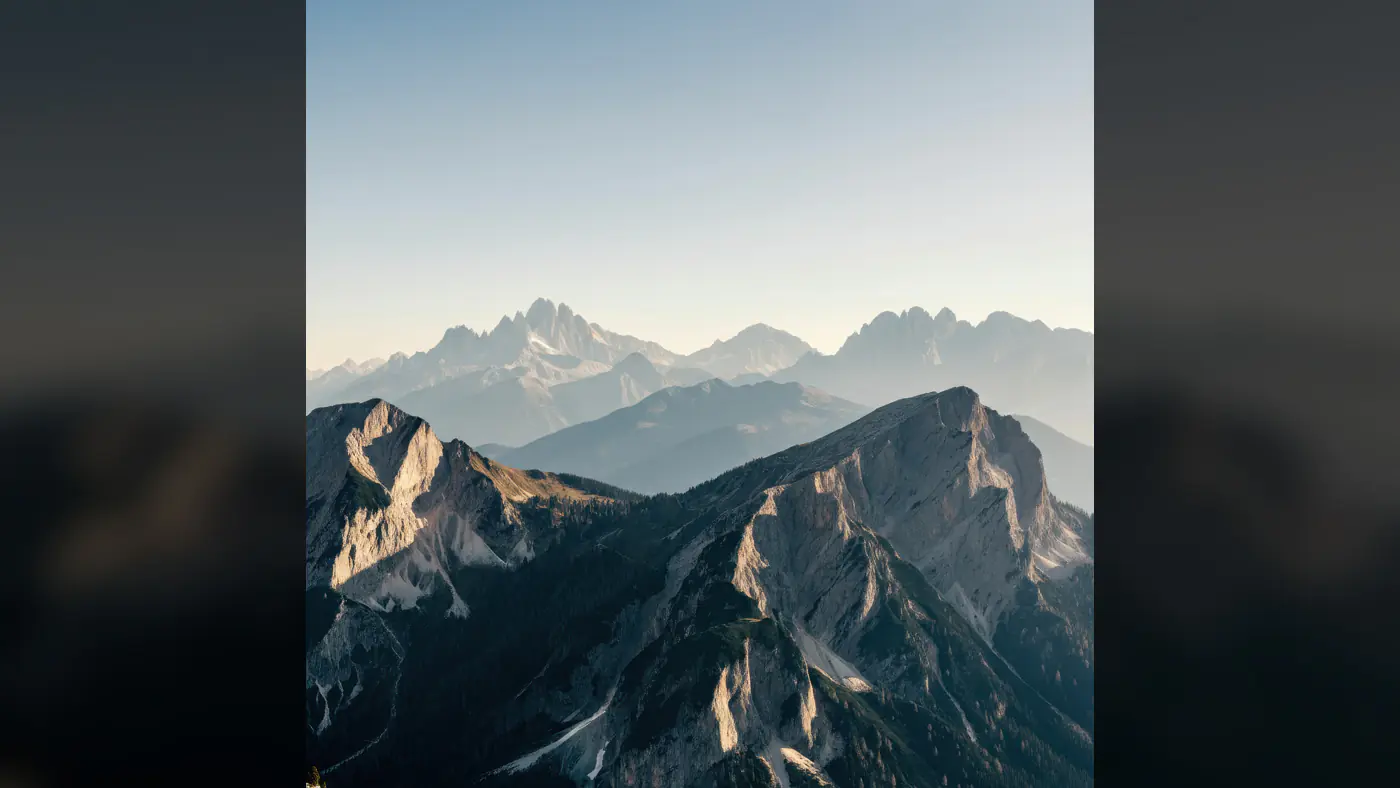 Stunning Mountain Range with Misty Peaks at Sunrise