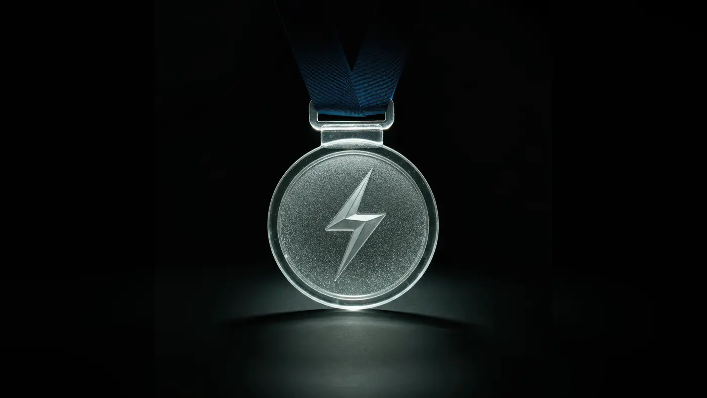 Silver Medal with Lightning Bolt Design on Dark Background