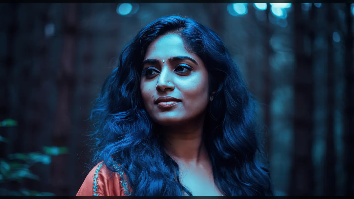 Elegant Indian Woman with Flowing Hair in Blue Forest Ambience