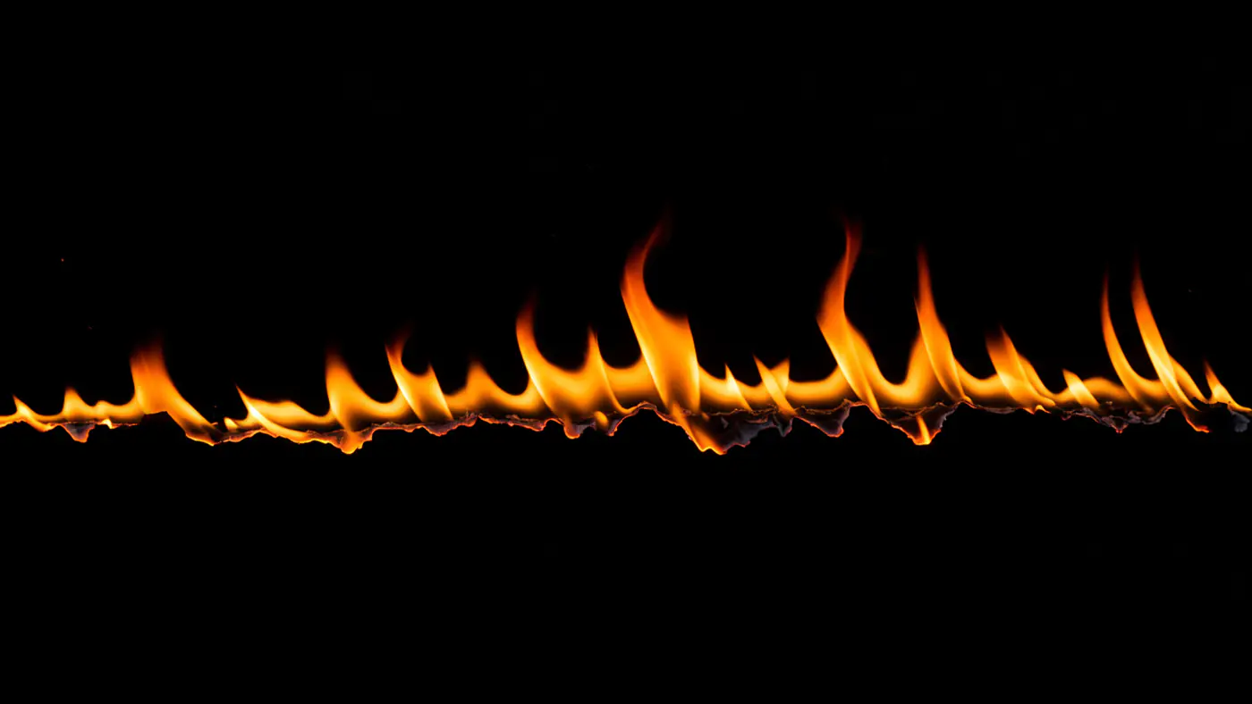 Sharp Rising Flame Line on Black Background
