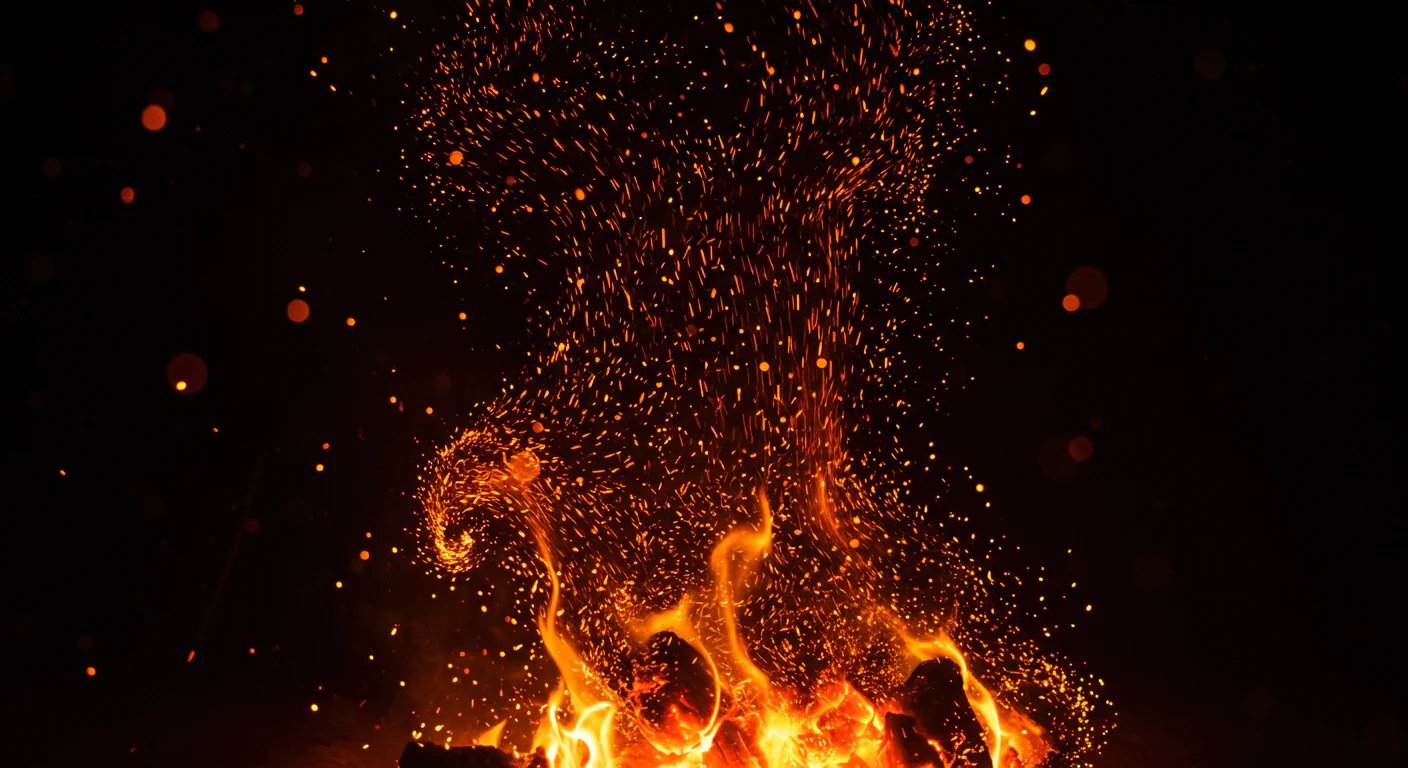 Dynamic Rising Flames with Embers and Sparks on Dark Background
