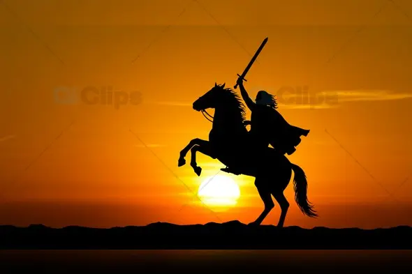 Warrior on Rearing Horse Silhouette Against Golden Sunset