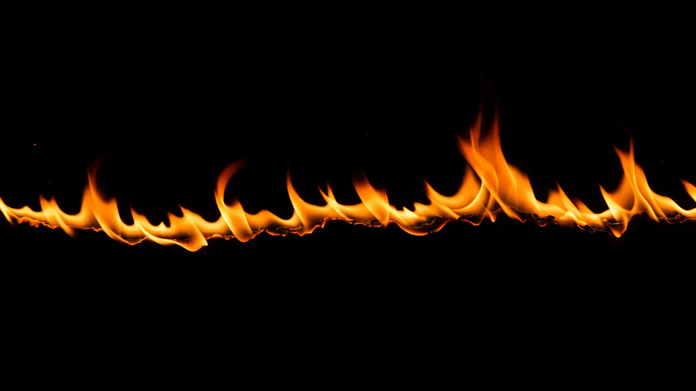 Horizontal Line of Flames on Black Background