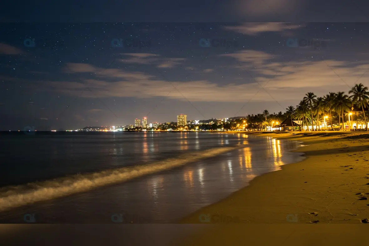 Tropical Beach Cityscape at Night with Starry Sky
