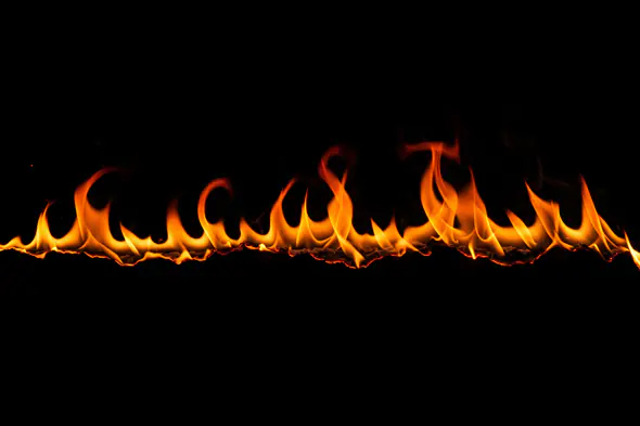 Wavy Line of Flames on Black Background