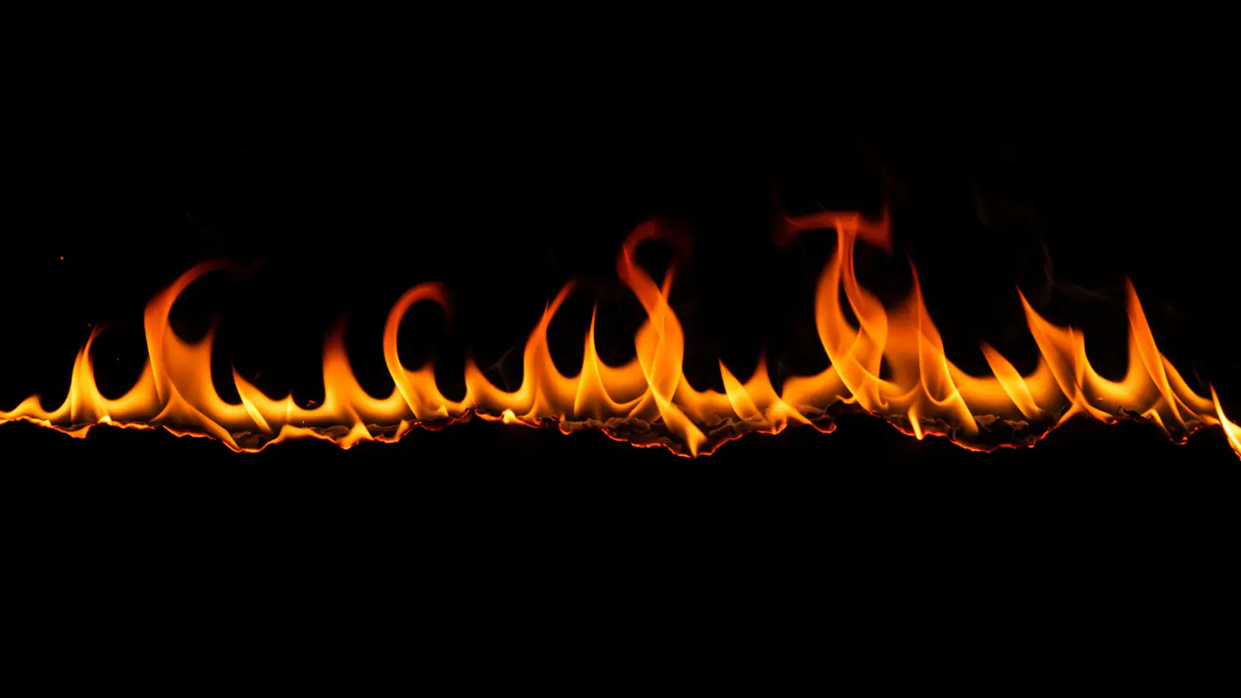 Wavy Line of Flames on Black Background