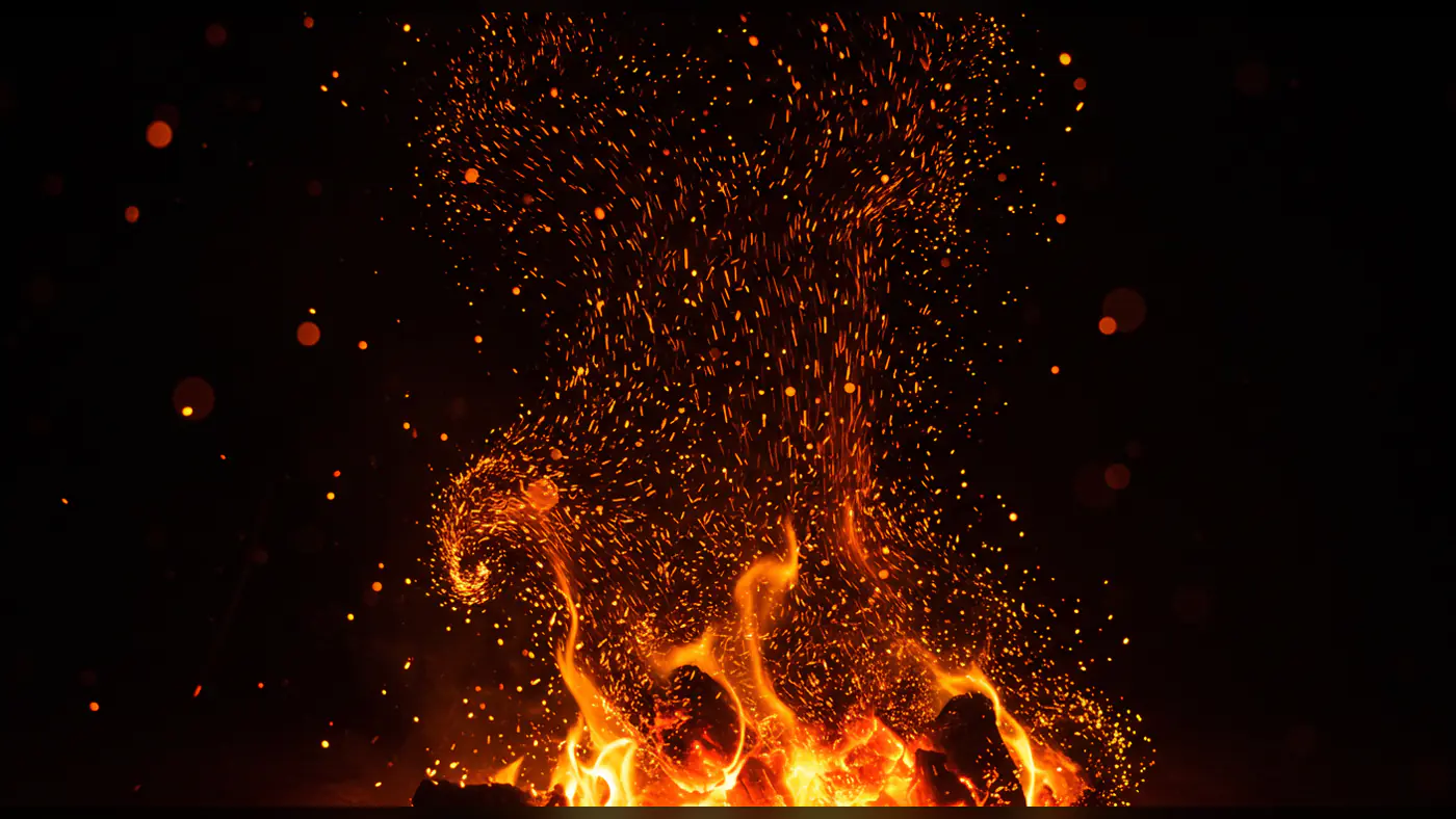 Dynamic Rising Flames with Embers and Sparks on Dark Background