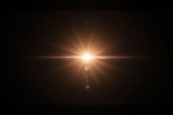 Golden Light Burst Lens Flare Effect on Dark Background