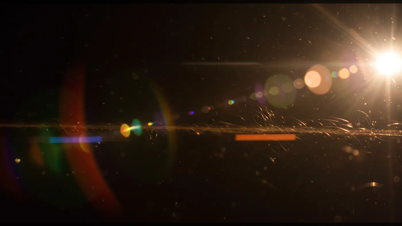 Realistic Lens Flare with Dust Particles for Cinematic Light Effects