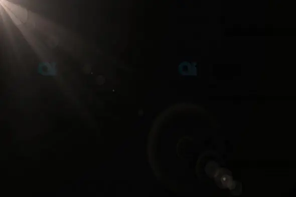 Subtle Light Rays with Lens Flares on Black Background