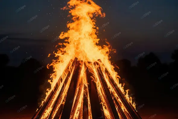 Towering Flames of a Ceremonial Fire at Dusk