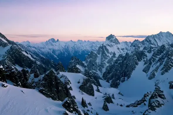 Snowy Mountain Range at Twilight with Pink Sky