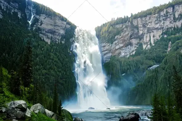 Majestic Mountain Waterfall Cascading Through Rocky Cliffs