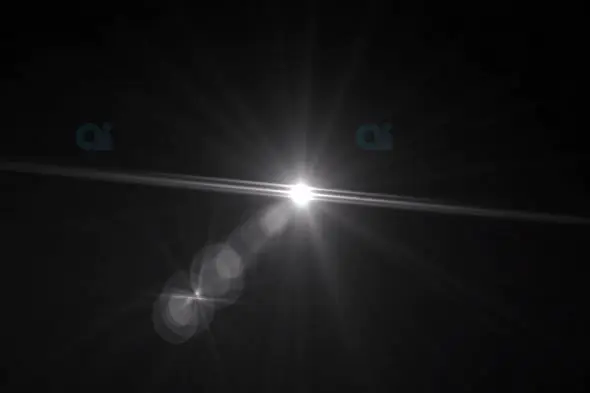 Dynamic Lens Flare with Radiant Light on Black Background