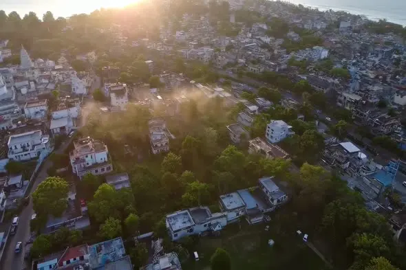 Sunset Aerial View of Urban Housing on Hillside