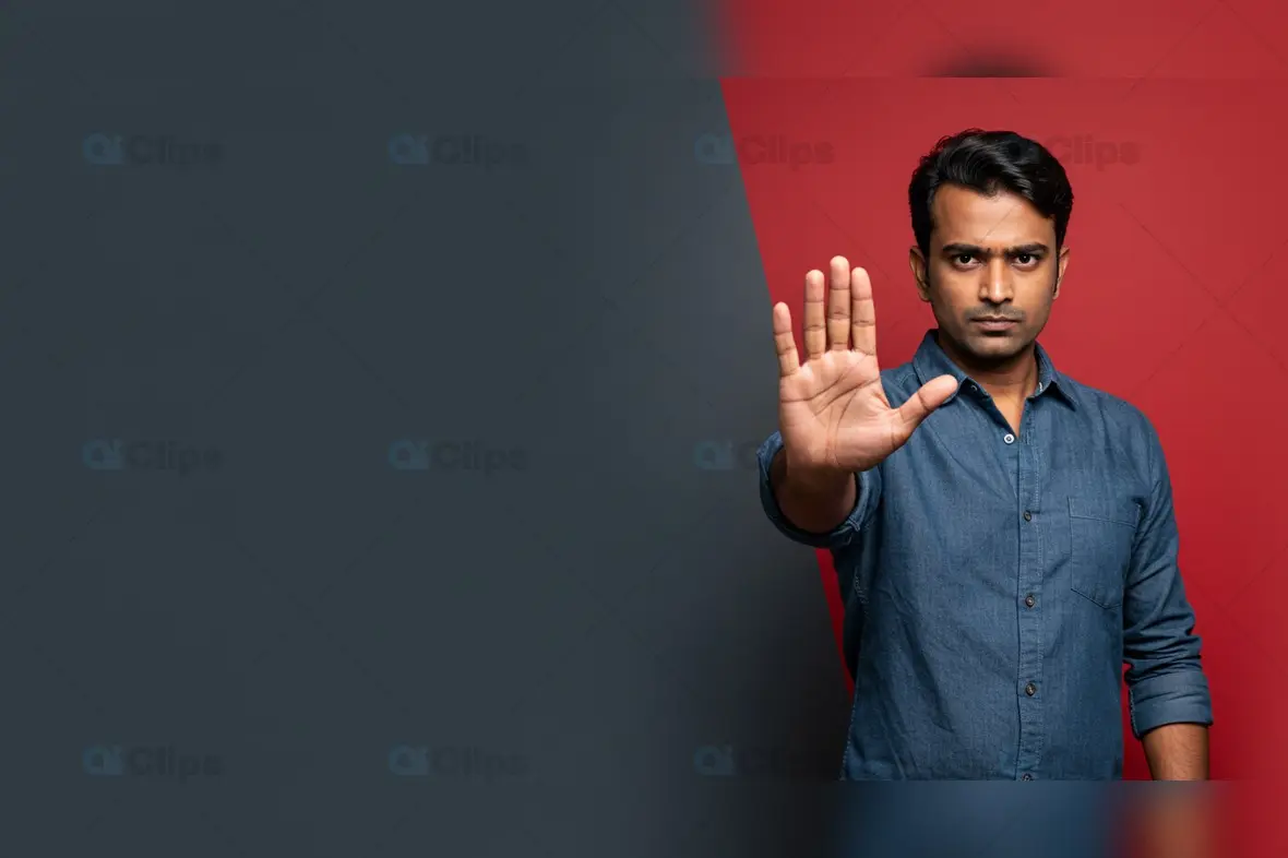 Serious Man Gesturing Stop on Red and Gray Background