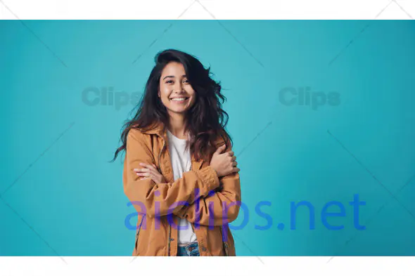 Smiling Woman in Tan Jacket on Blue Background