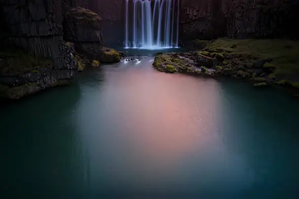 Mystical Waterfall Illuminates Emerald Pool Twilight Ambiance