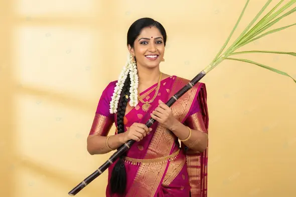 Vibrant South Indian Woman with Sugarcane for Harvest Festival