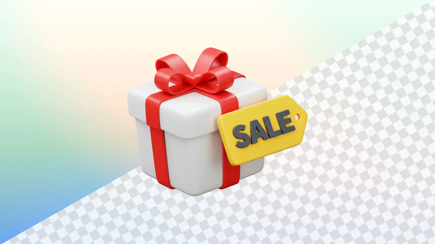 Gift box with red ribbon and yellow sale tag