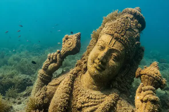 Underwater Vishnu Statue Covered in Coral Reefs