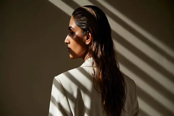 Woman with wet hair in business attire