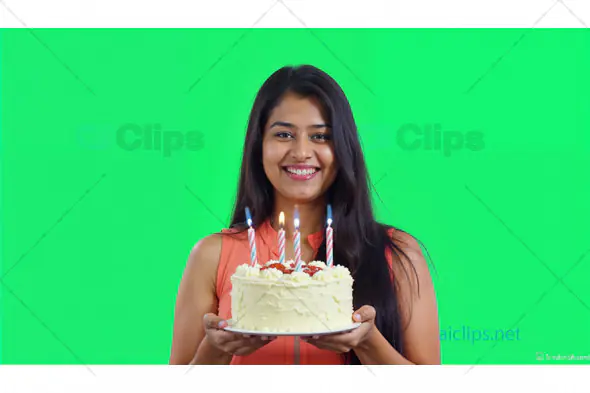 Woman Holding Birthday Cake with Candles