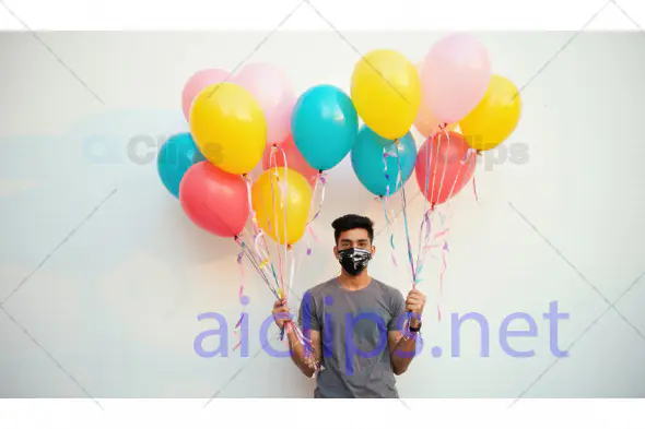 Masked Man Holding Colorful Balloons