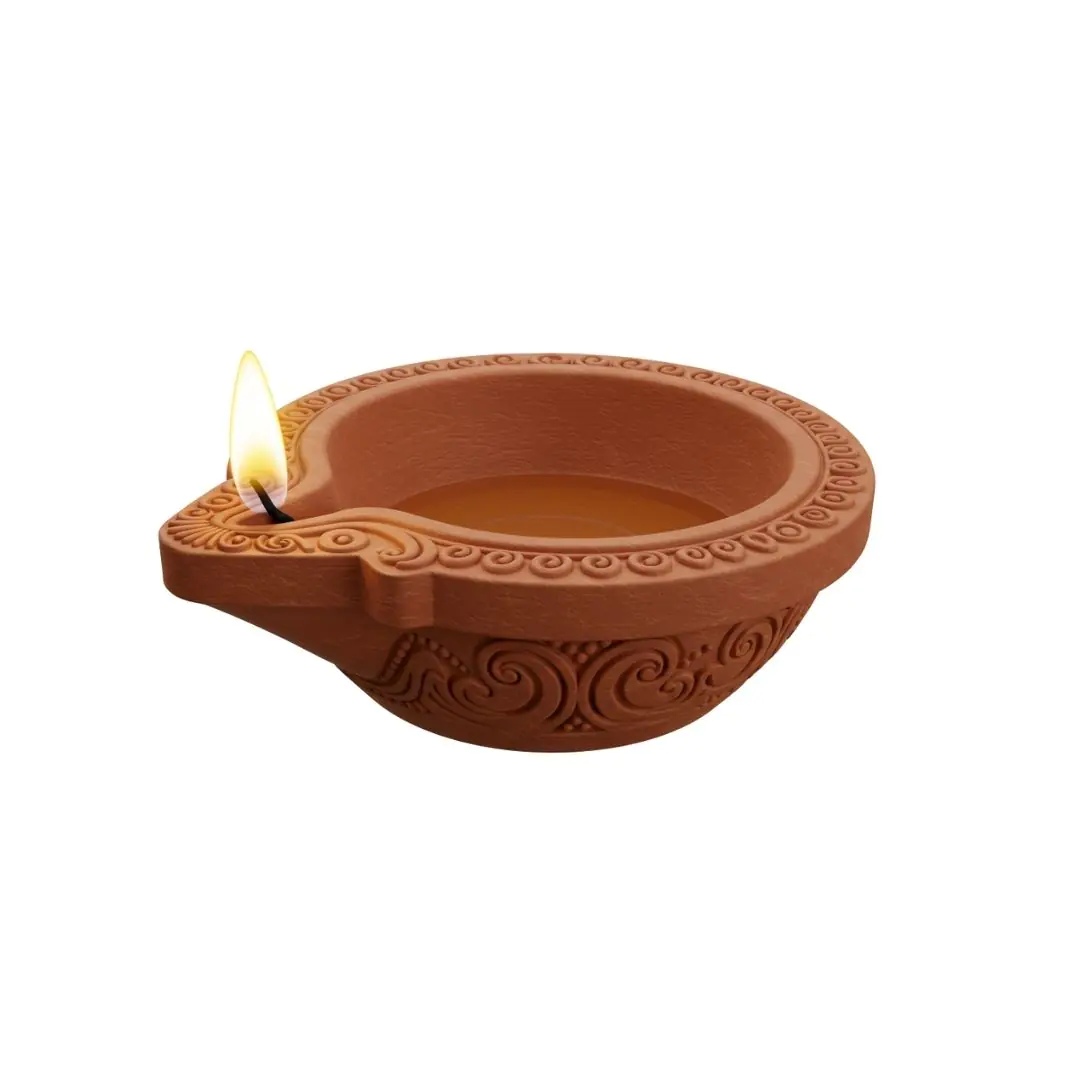 Terracotta diya lamp with ornate swirl patterns