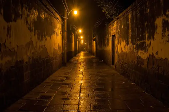 Rain-Soaked Empty Alley with Dim Streetlights Cinematic