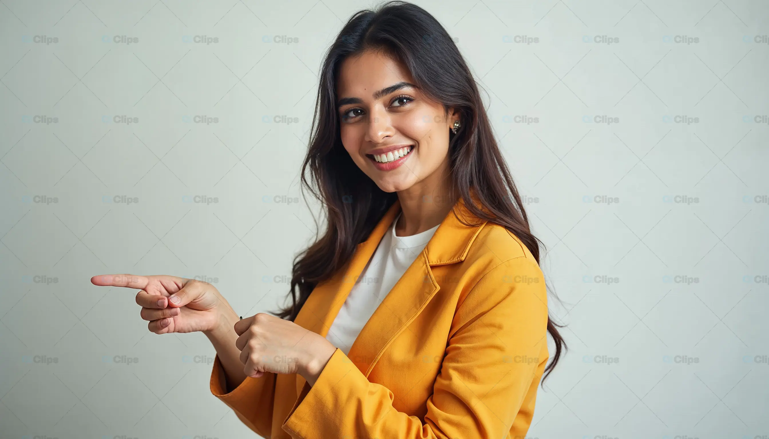Young Woman Smiling and Pointing to the Side