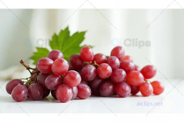 Fresh Red Grapes with Green Leaf