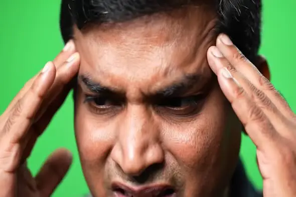 Intense Headache Expression on Green Screen