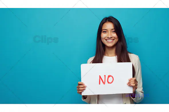 Smiling Woman Holding "No" Sign