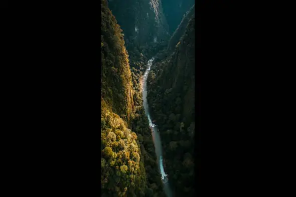 Aerial View of a River Cutting Through Mountainous Terrain
