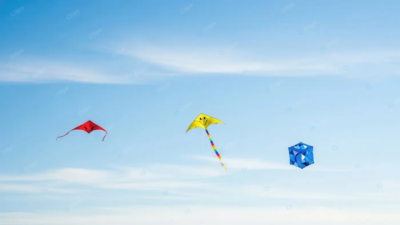 Colorful Trio of Kites Against a Clear Sky