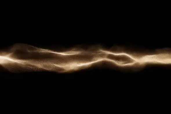 Shimmering golden particle wave on black background