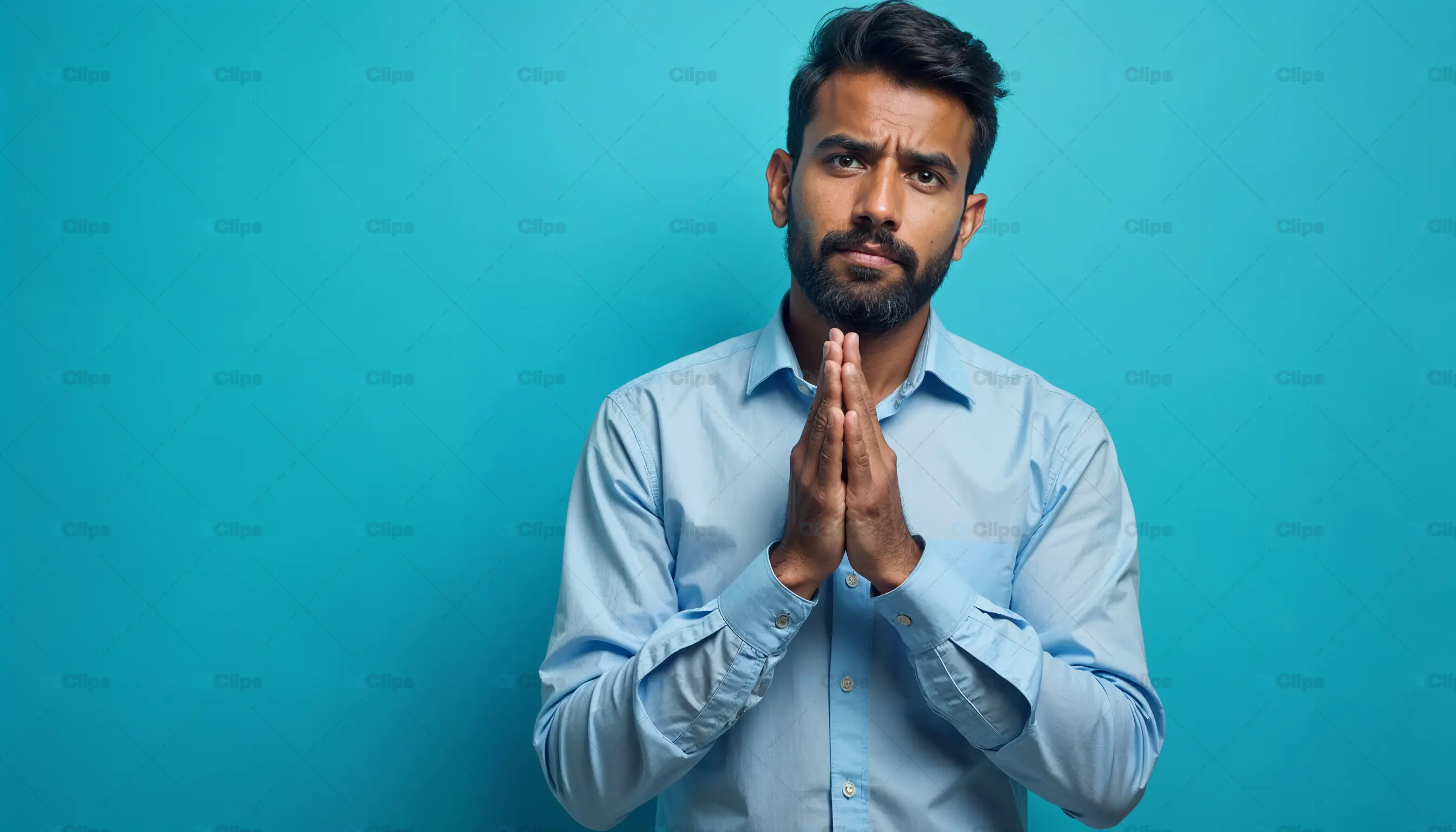 Man in Prayer Gesture Seeking Apology